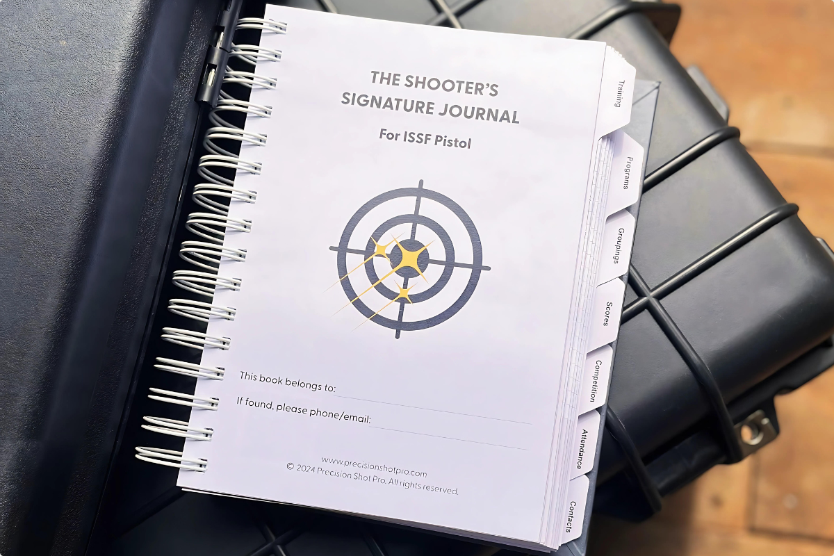 Shooter's Signature Journal open on a range case showing training logs and planning pages